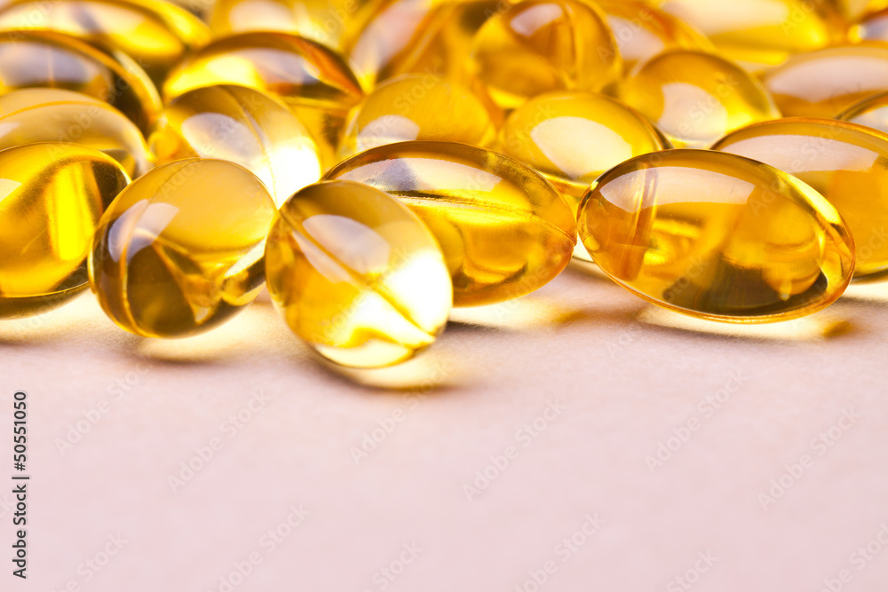 Cod liver oil omega 3 gel capsules isolated on white background 