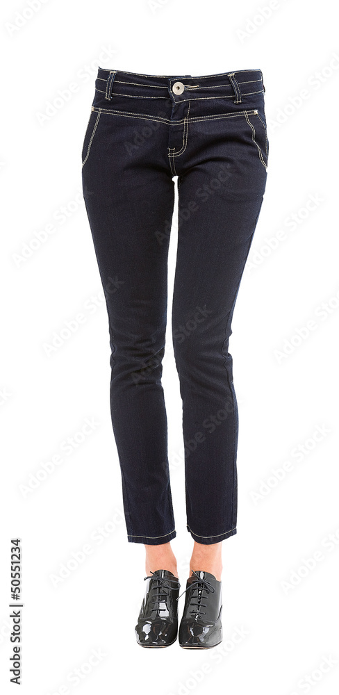 Young woman legs with jeans and grey patent leather lace up pump Young woman legs with jeans and grey patent leather lace up pump