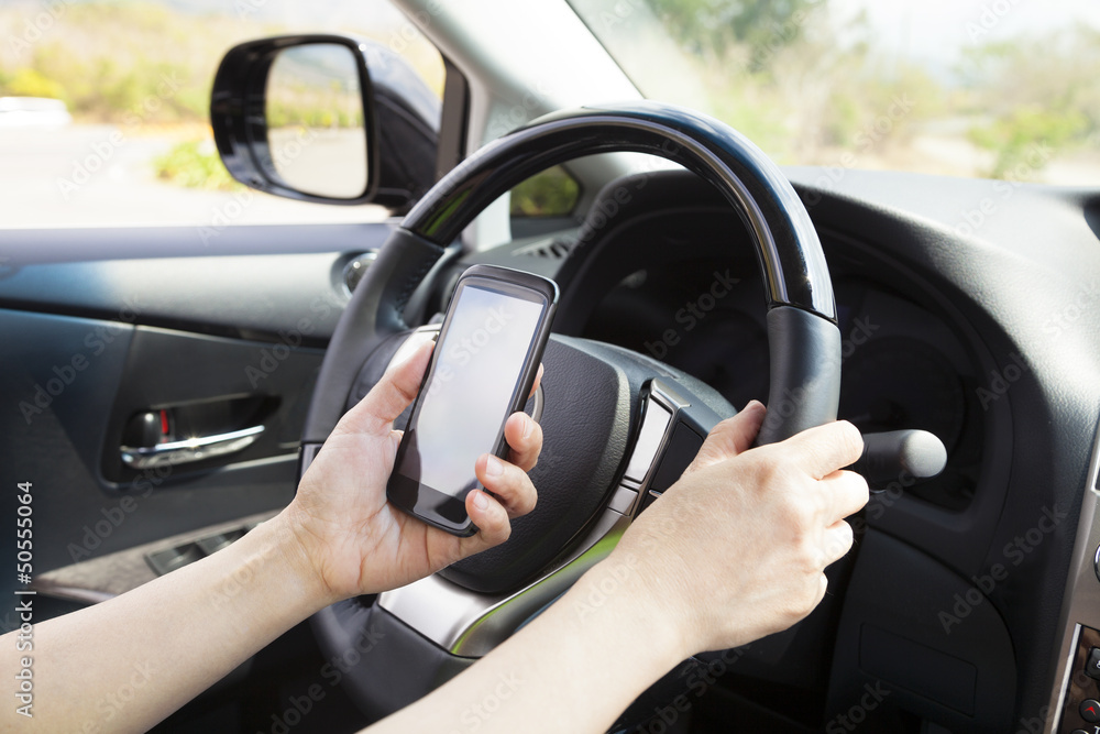 smart phone in hand while driving the car smart phone in hand while driving the car