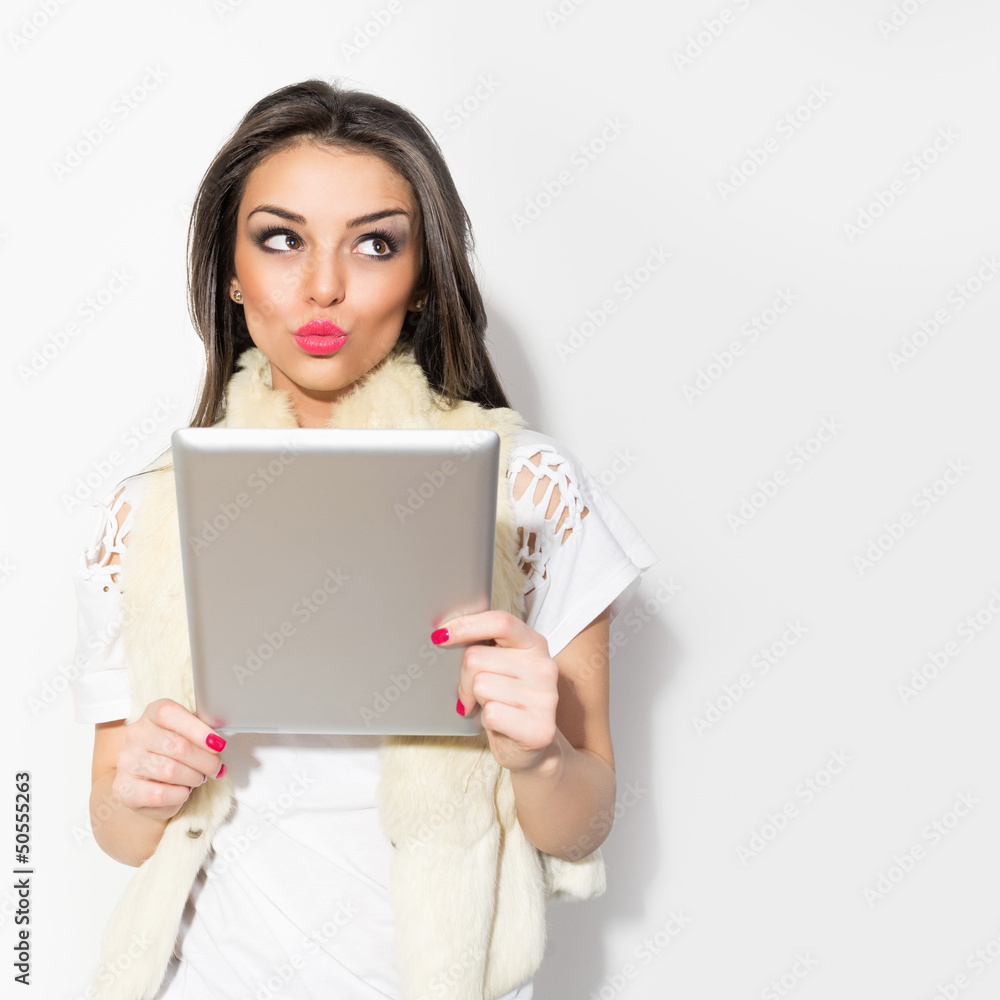 Young hipster brunette woman using digital tablet Young hipster brunette woman using digital tablet