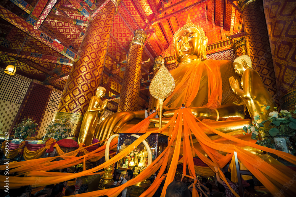 Fototapeta premium Thai people delicate the yellow robe to 