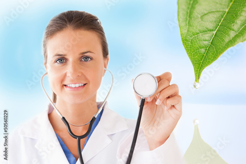 Doctor holding up stethoscope for natural treatment