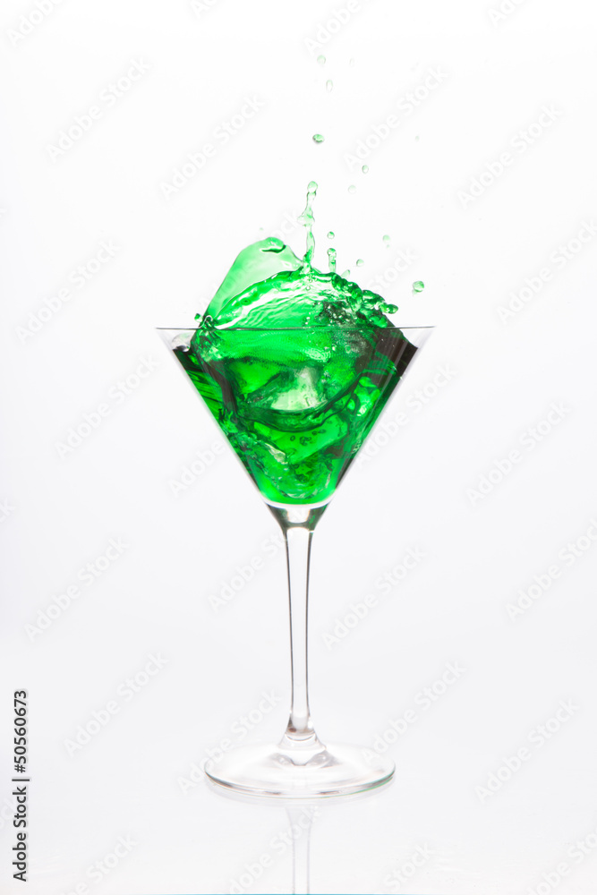 Cocktail glass with green alcohol