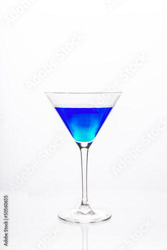 Cocktail glass with blue alcohol