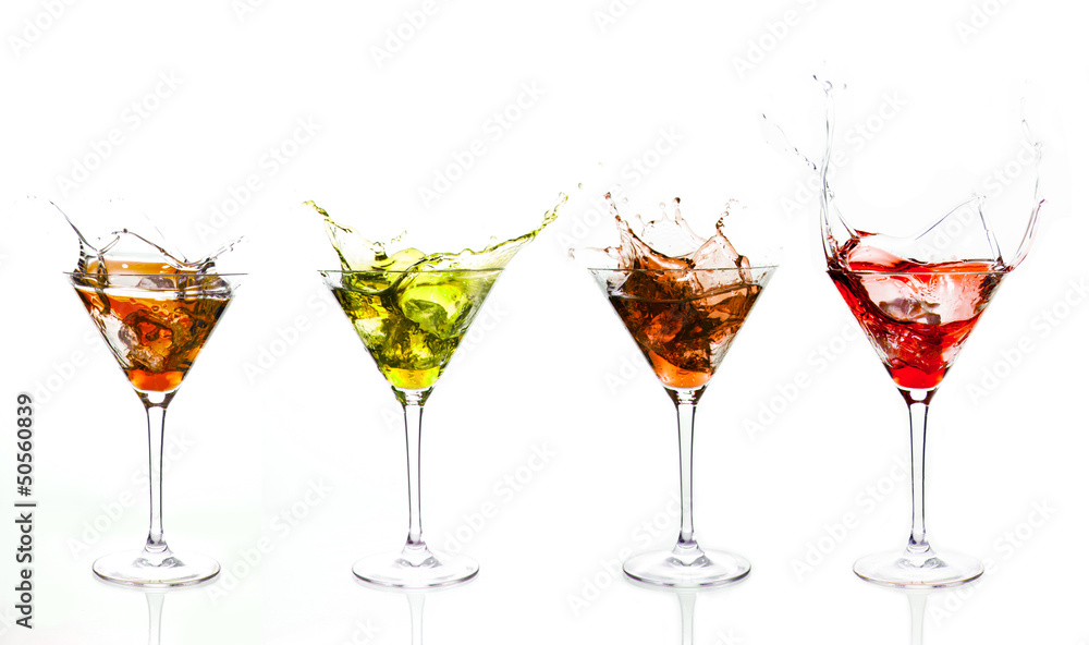 Serial arrangement of coloured liquids splashing in cocktail gla Serial arrangement of coloured liquids splashing in cocktail gla