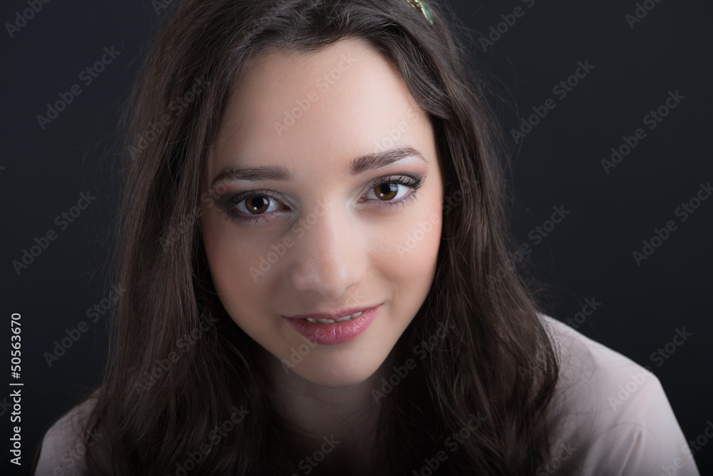portrait of a beautiful young woman posing in studio portrait of a beautiful young woman posing in studio