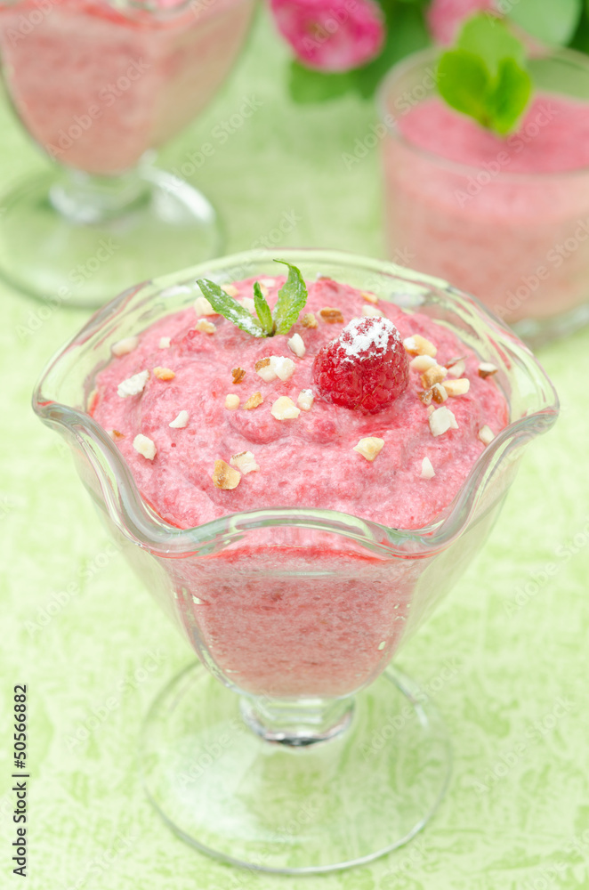 Raspberry mousse with mint and fresh raspberries closeup Raspberry mousse with mint and fresh raspberries closeup