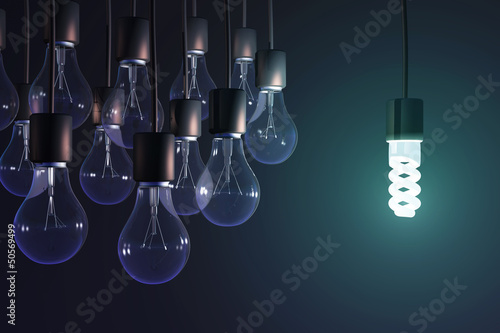 energy-saving lamp among the gray bulb