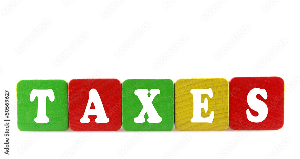 taxes - isolated text in wooden building blocks