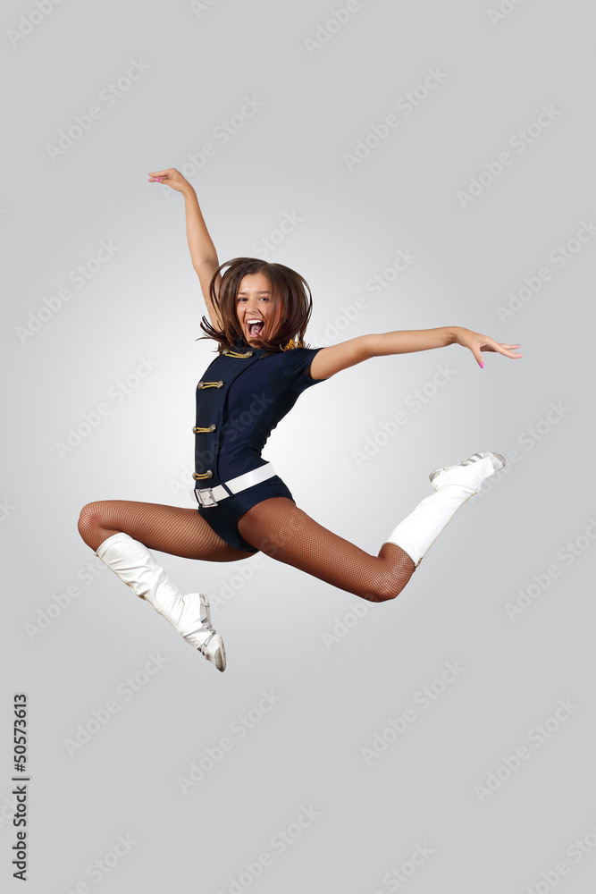 Young female dancer against white background