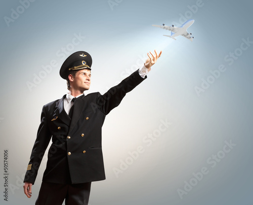 Image of pilot touching air photo