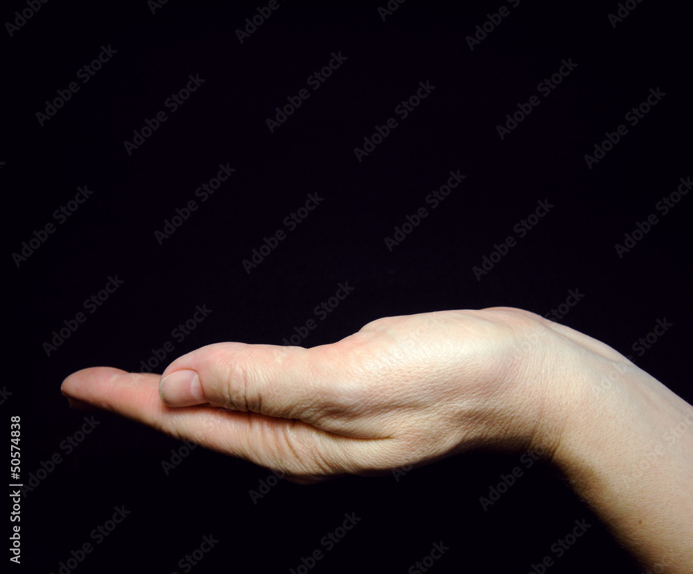Female woman hand holding on black background Female woman hand holding on black background