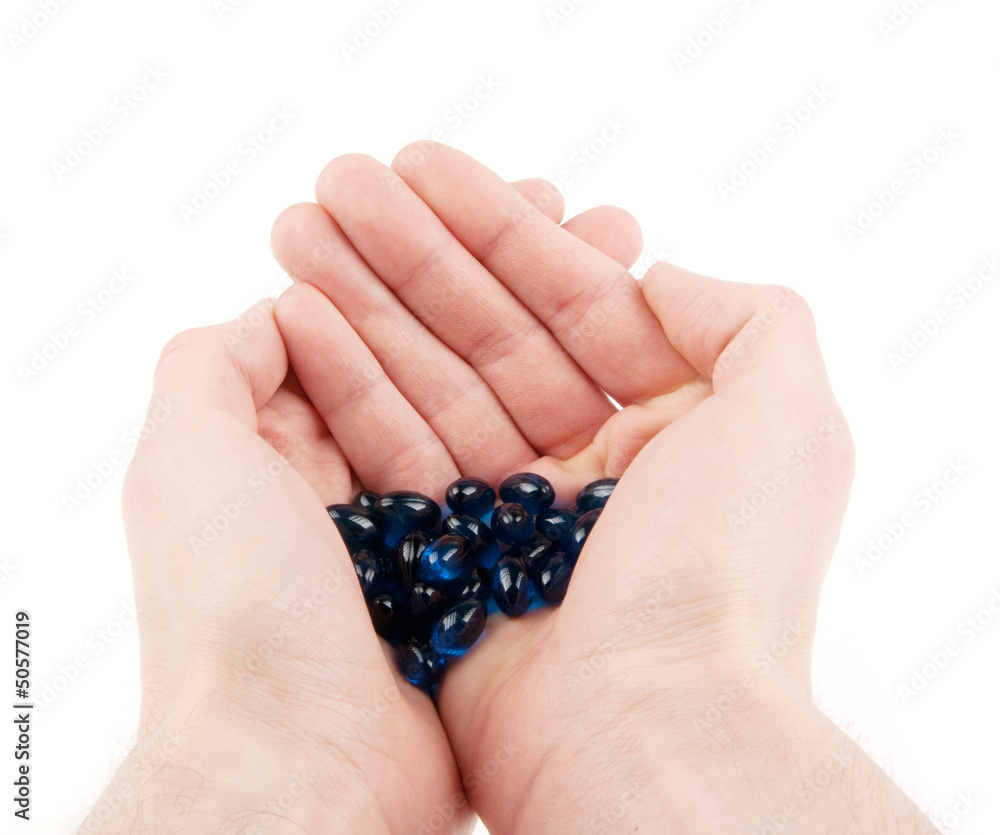 Pills in hands isolated on white Pills in hands isolated on white