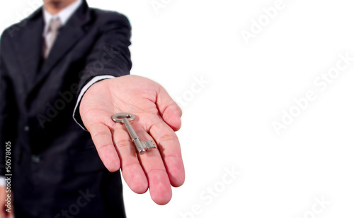 A business man giving you the keys to a home