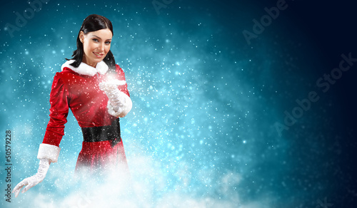 Portrait of girl wearing santa claus clothes