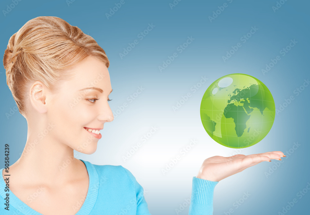 woman holding green globe on her hand woman holding green globe on her hand