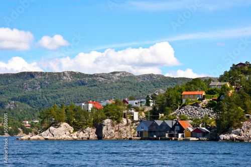 Houses and huts on the shore of  Bergen fjord. photo