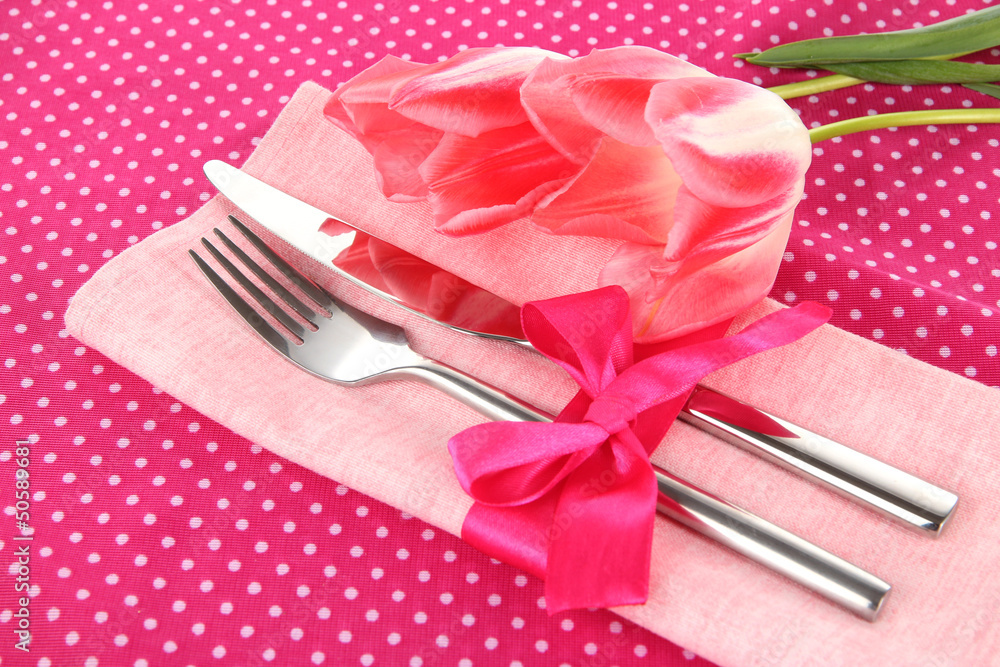 Festive dining table setting with tulips Festive dining table setting with tulips