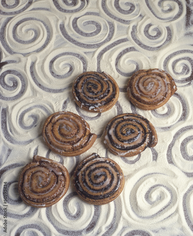Fototapeta premium sweet cakes on flour background