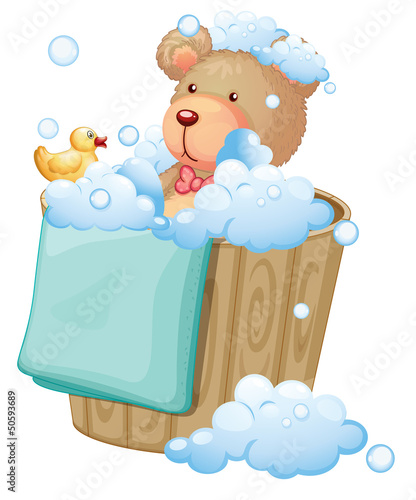 A bear inside the pail full of bubbles