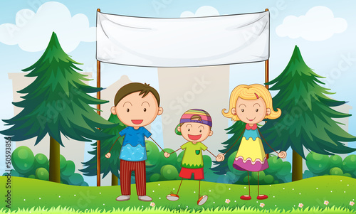 A family at the park with an empty banner