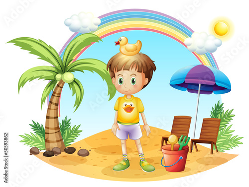 A young child with his toys near the coconut tree