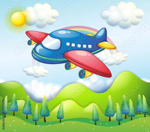 A colorful airplane above the hills