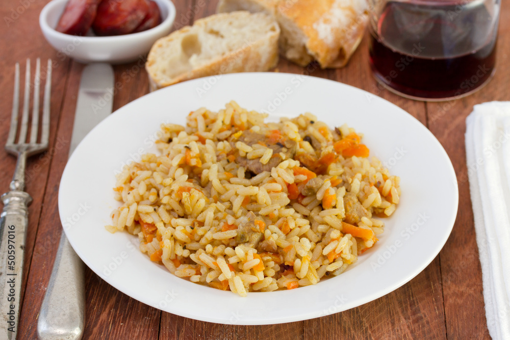 rice with vegetables and meat on the plate rice with vegetables and meat on the plate