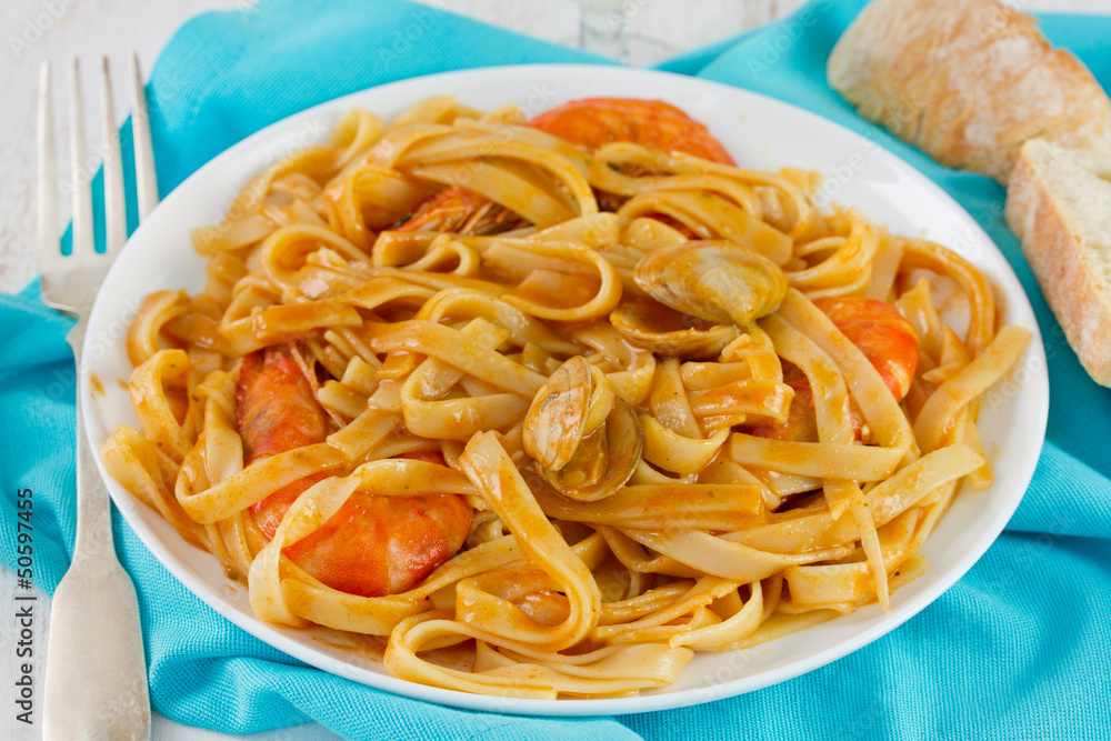 spaghetti with seafood on the white plate spaghetti with seafood on the white plate