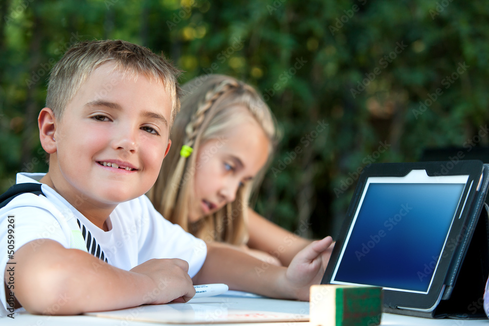 Young boy showing tablet with copy space. Young boy showing tablet with copy space.