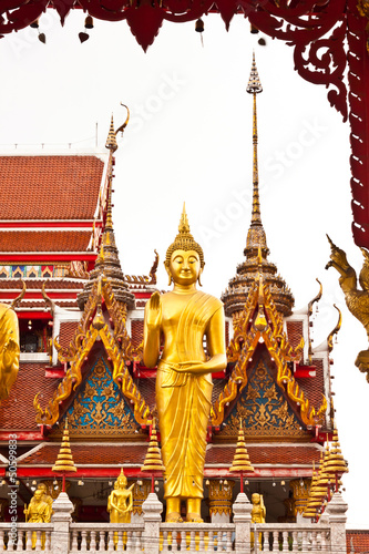 standing buddha statue in thailand © phoopanotpics