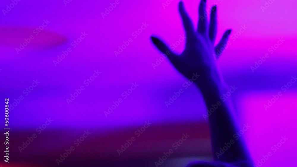 Girl's hand in the air enjoying the music. Girl's hand in the air enjoying the music.