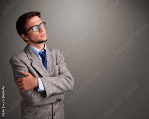 Young man thinking with empty copy space