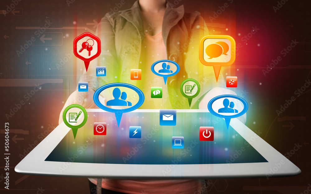 Fototapeta premium Girl presenting a tablet with colorful social icons and signs