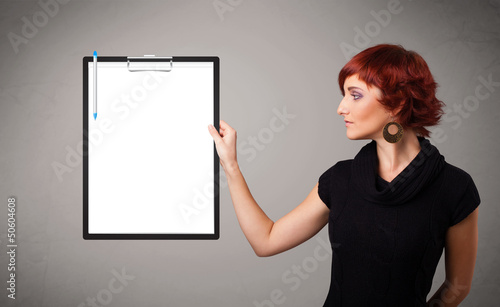 Young girl holding black folder with white sheet copy space