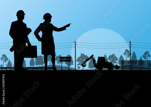 Excavator loader and workers digging at construction site with r