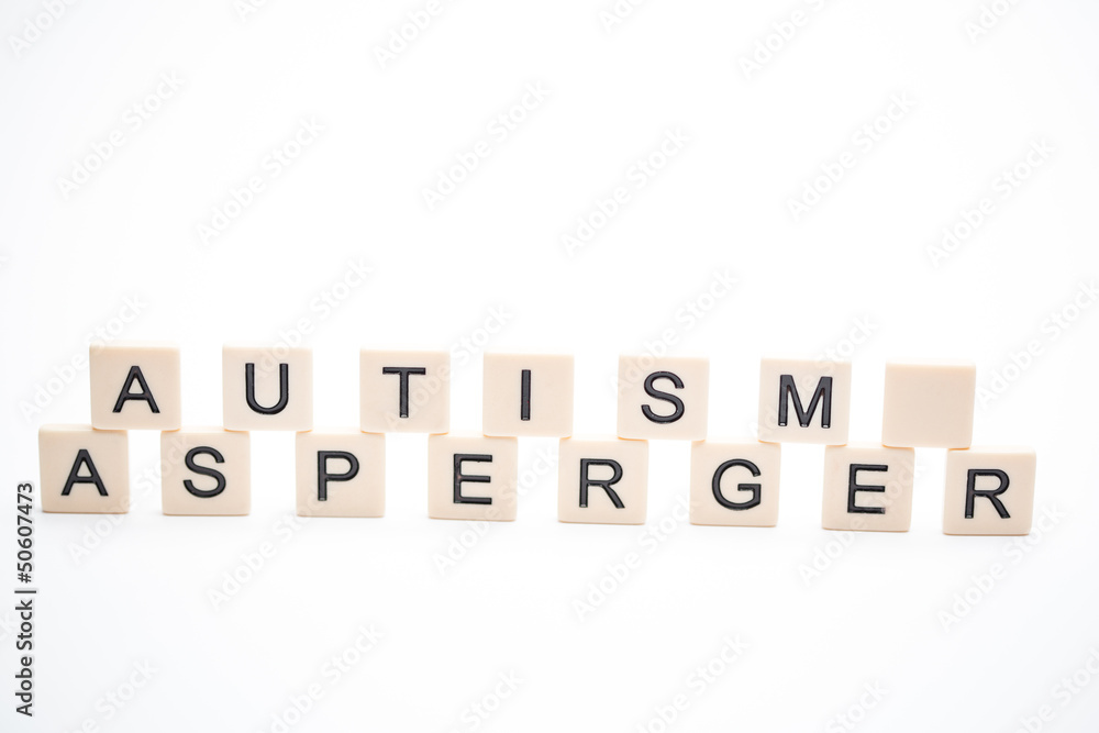 Autism and asperger spelled out in plastic letter pieces Autism and asperger spelled out in plastic letter pieces