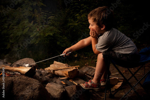 Boy cooking marshmallow