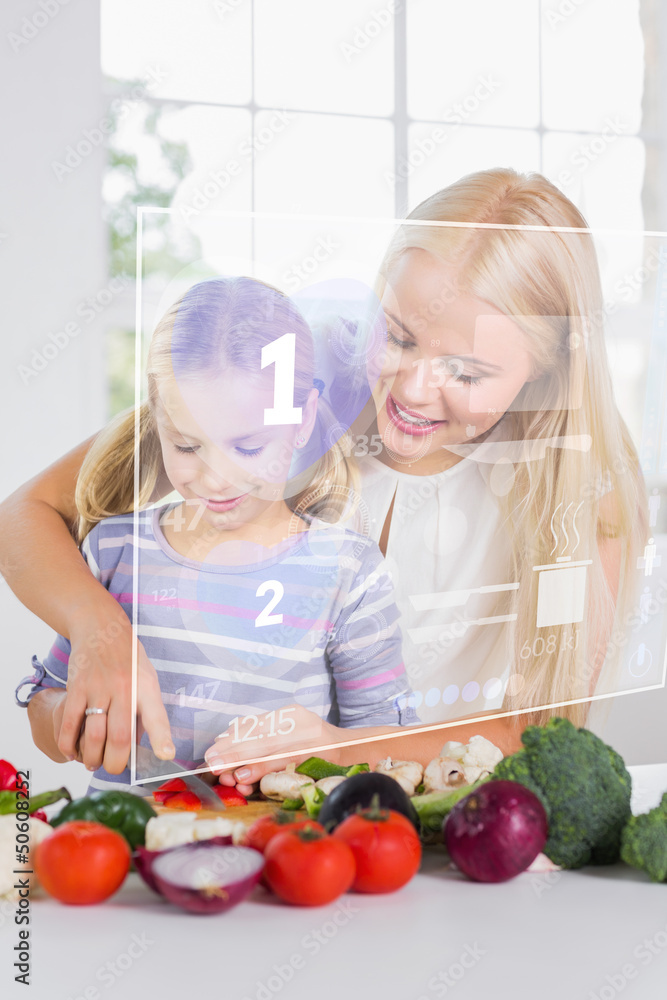 Mother and daughter chopping vegetables with holographic interfa