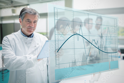 Confident scientist working with tablet and futuristic interface