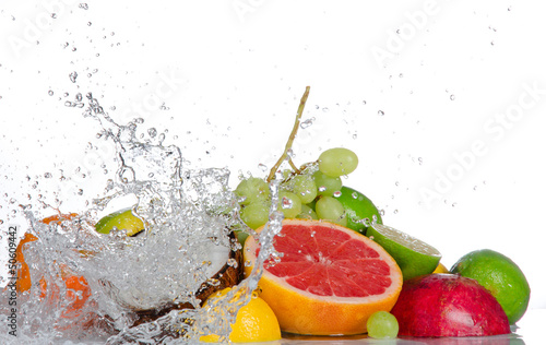 Fresh fruits with water splash isolated on white