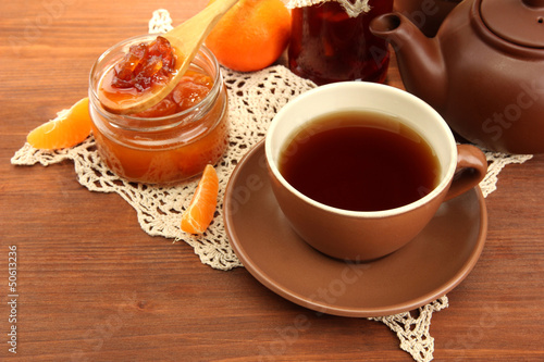 light breakfast with tea and homemade jam  on wooden table