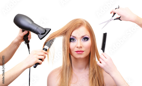 Beautiful woman and hands with brushes, scissors and hairdryer
