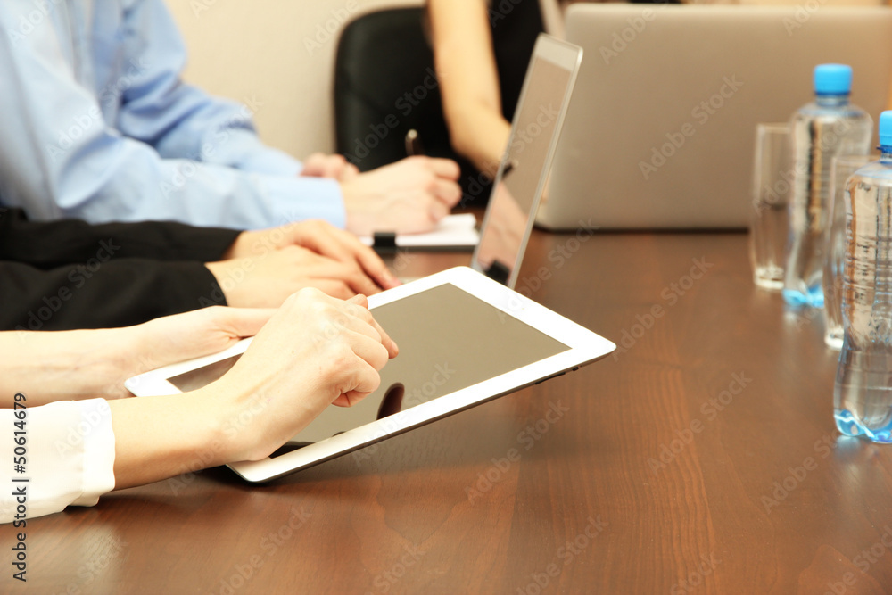 Female hands with digital tablet on office background. Female hands with digital tablet on office background.