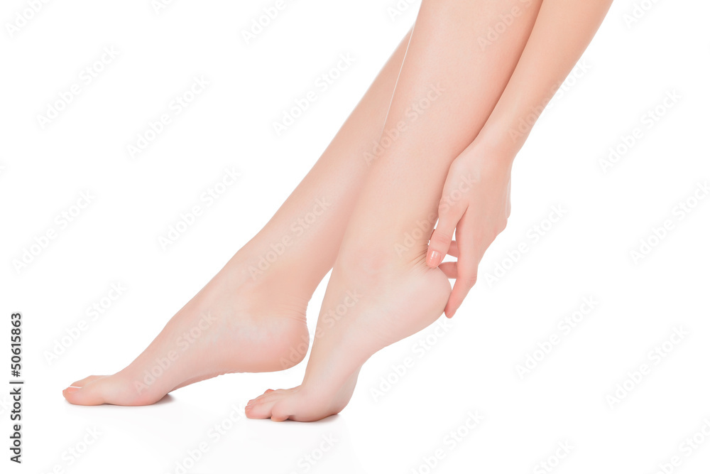 Woman touching her heel Woman touching her heel