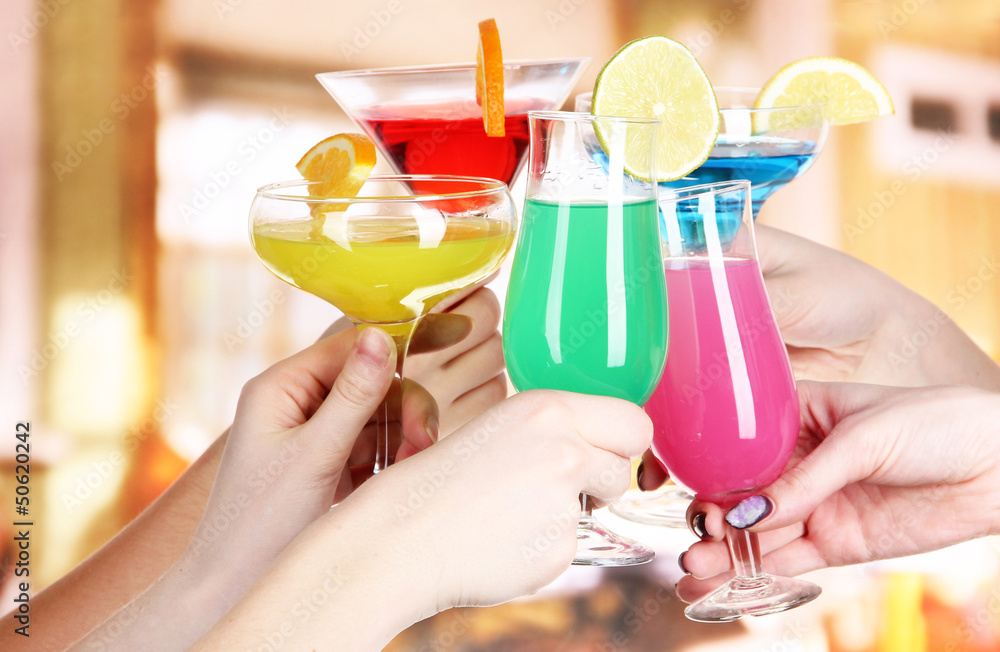 Cocktails in hands in cafe Cocktails in hands in cafe
