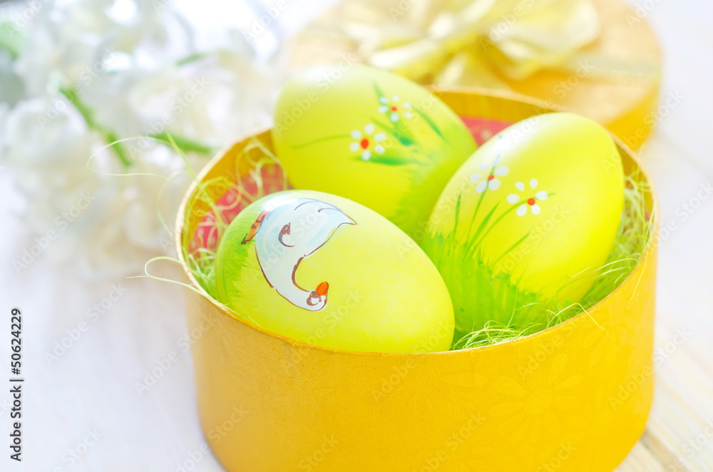 Fototapeta premium easter eggs in yellow box