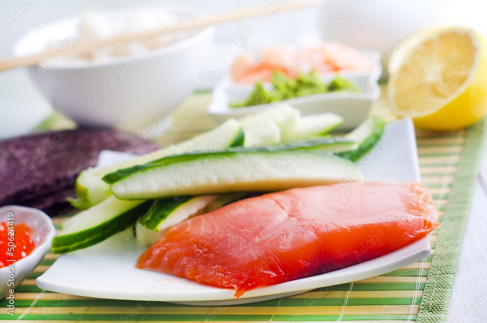 ingredients for sushi, sakmon and cucumber