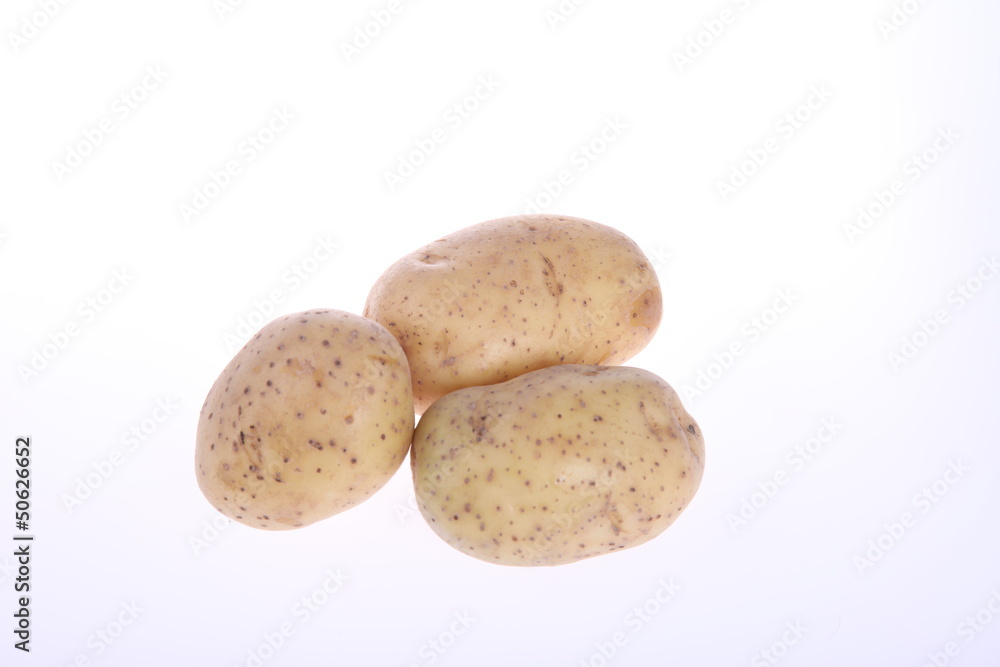 Three unpeeled potatoes Three unpeeled potatoes