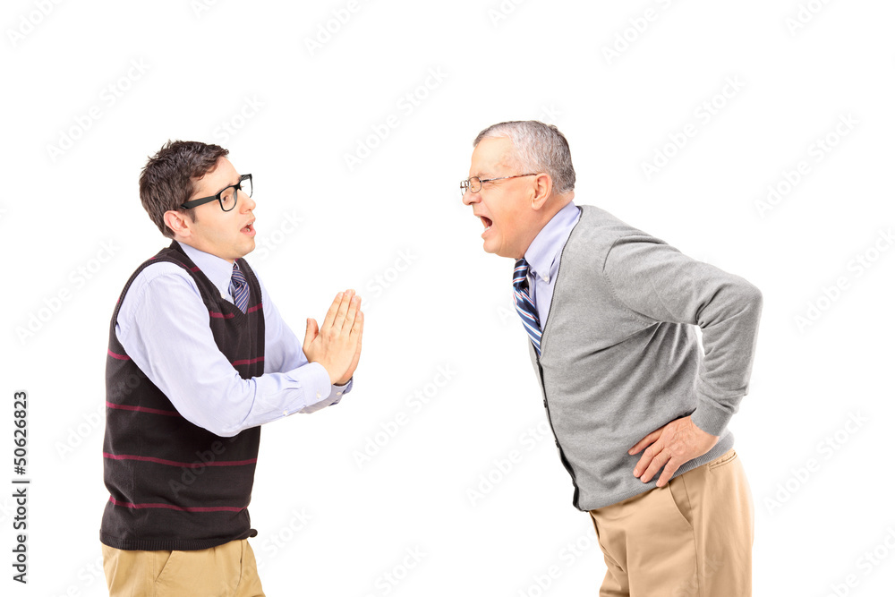 Mature man shouting at a man who is begging Mature man shouting at a man who is begging